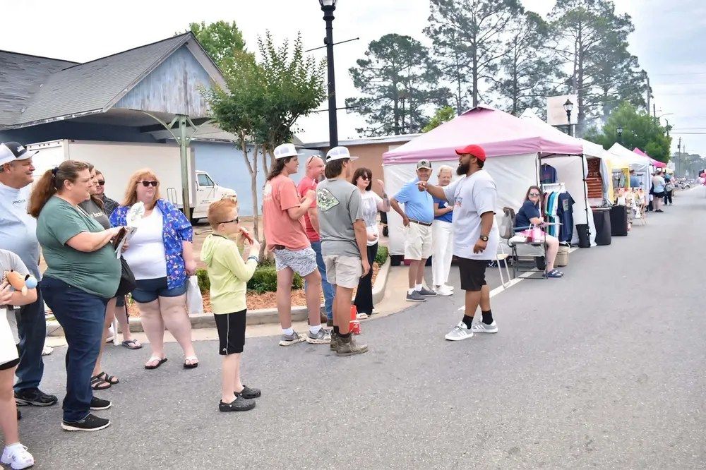 Micah King speaking with a local farm advocate